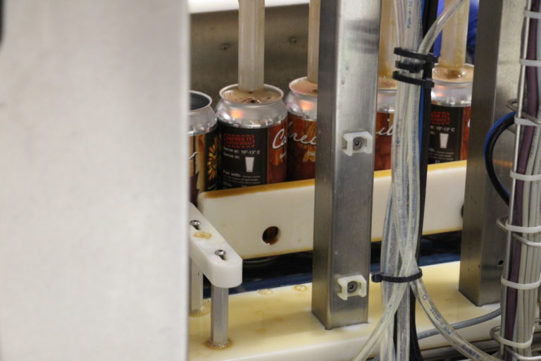 Cans being filled with Caribrew