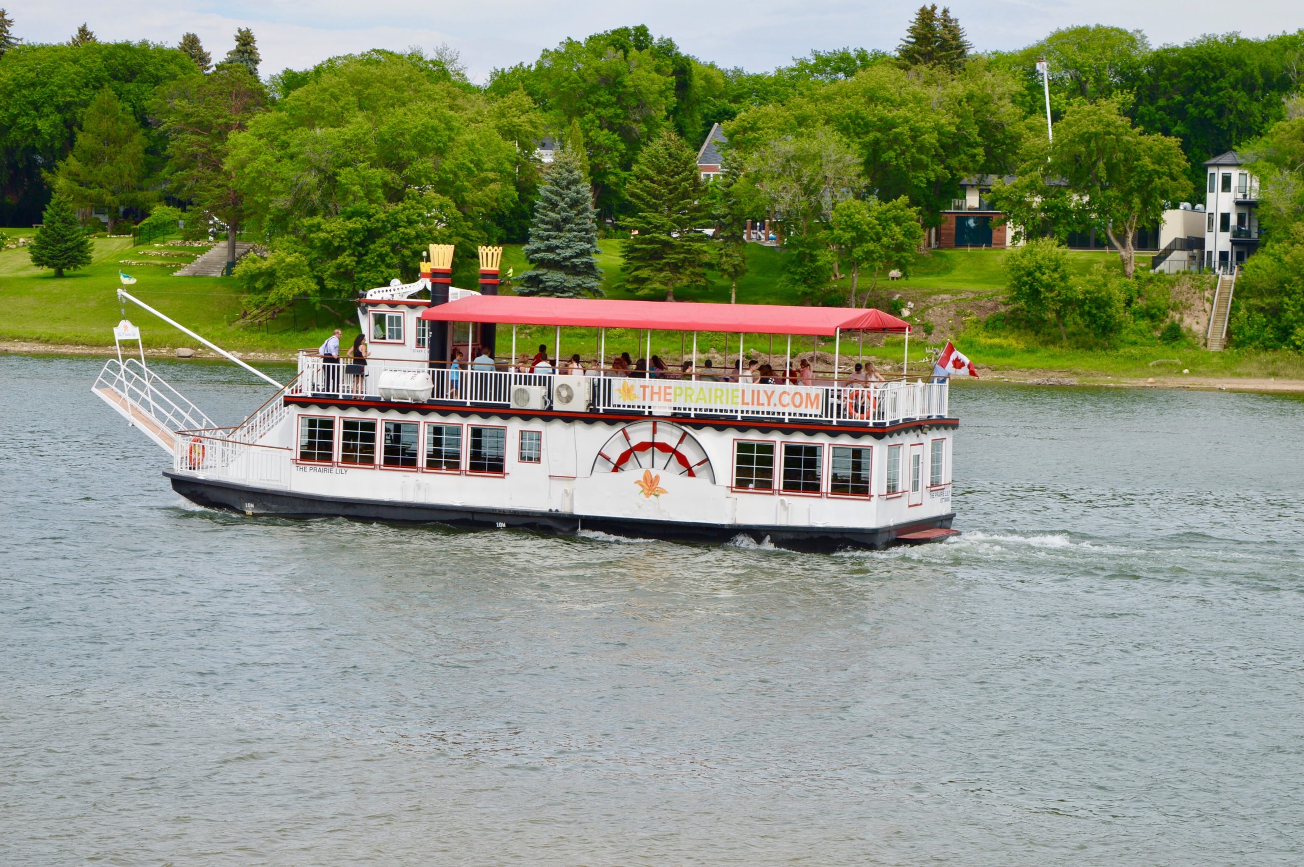 The Prairie Lily boat floating down the river in Saskatoon on a summer day.