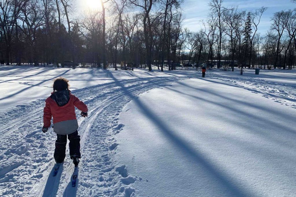 Children cross country ski at the Kildonan Park Golf Course in Manitoba, January 2021. Photo by Mira Oberman