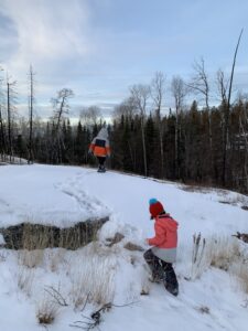 Kids hiking the Whiteshell River Trail in winter 2021. Photo by Mira Oberman